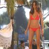 Adriana Lima exposed her pokies and bikini in a video shoot