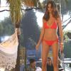 Adriana Lima exposed her pokies and bikini in a video shoot