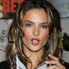 Alessandra Ambrosio exposed holds her yellow leopard bra