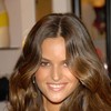 Alessandra Ambrosio exposed holds her yellow leopard bra