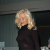 Christina Aguilera exposed her bra and panties in a sheer dress