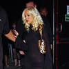 Christina Aguilera exposed her bra and panties in a sheer dress