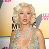 Christina Aguilera exposed her plunging cleavage in a sparkling dress