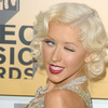 Christina Aguilera exposed her plunging cleavage in a sparkling dress