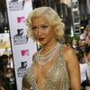 Christina Aguilera exposed her plunging cleavage in a sparkling dress