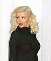 Christina Aguilera exposed her sexy red bra again in a see through sweater