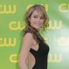 Erica Durance exposed her plunging cleavage in a black dress