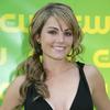 Erica Durance exposed her plunging cleavage in a black dress