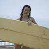 Evangeline Lilly exposed her bikini body behind a surfboard