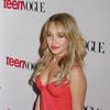 Hayden Panettiere exposed her cleavage in a red dress