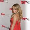 Hayden Panettiere exposed her cleavage in a red dress