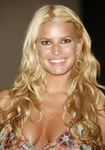 Jessica Simpson exposed her cleavage in a low cut dress