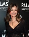 Kelly Hu exposed her black lace bra in a see through blouse