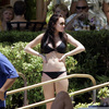 Lindsay Lohan exposed her boobs being felt in a black bikini
