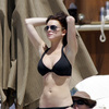 Lindsay Lohan exposed her boobs being felt in a black bikini