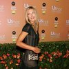 Maria Sharapova exposed her beige slip in a see through dress
