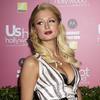 Paris Hilton exposed her black bra in an open dress