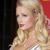 Paris Hilton exposed her black bra in an open dress