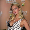 Paris Hilton exposed her black bra in an open dress