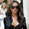 Victoria Beckham exposed her lacy black bra under her blouse