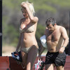 Victoria Silvstedt exposed her butt in a gold bikini